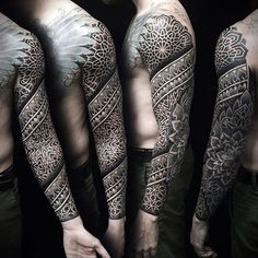 three men with tattoos on their arms and chest, one has an intricate design in the middle