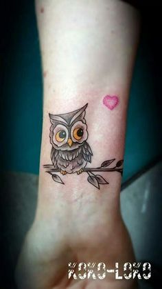 an owl tattoo on the ankle