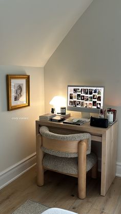 a desk with a computer on top of it