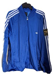 adidas Originals Label USA Men's Track Jacket   LEATHER adidas left sleeve  Trefoil 3-Stripes  Vintage Deadstock 2005 100% Authentic New With Tag Size: XL Color:  Royal/White 78% Nylon  22% Polyester  Lightweight and soft inside Embroidered Trefoil left breast Full Zipper w/metal Trefoil pull Side pockets Ribbed cuffs & waist Chest across armpit to armpit 31 inches Sleeve armpit to cuff 25 inches  Length shoulder to waist 33 inches Style Code:  576115001 International Buyers are responsible for Adidas Cotton Track Jacket For Sports, Cotton Track Jacket With Three Stripes, Adidas Long Sleeve Track Jacket With Three Stripes, Adidas Sportswear Track Jacket With Three Stripes, Adidas Cotton Track Jacket In Casual Style, Cotton Track Jacket With Three Stripes Branding, Cotton Track Jacket With Three Stripes For Sports, Casual Three Stripes Track Jacket With Long Sleeves, Cotton Athleisure Track Jacket With Three Stripes