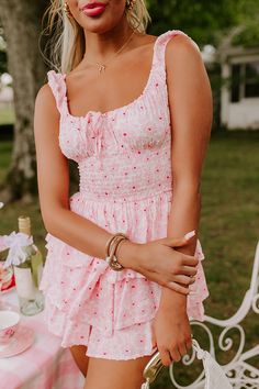 - Slip into this bubbly romper and let the good times roll! The tiered design adds a touch of whimsy, while the romper silhouette offers comfort and versatility. Effortlessly blending elegance with playfulness, this charming piece is perfect for brunch with friends or a sunny garden party. - Unlined lightweight material with a pink and red hued floral print and a dot texture - An elastic scoop cut neckline with a tie detail and a keyhole accent - Wide straps with elastic cuffs - A smocked waistl Natural Gamine, Sunny Garden, Dot Texture, Let The Good Times Roll, Fits Clothes, Good Times Roll, Pink And Red, Soft Natural, Floral Romper