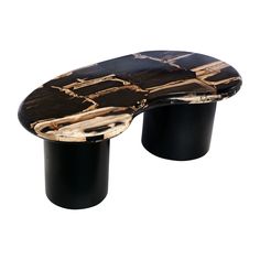 a black and white marble bench sitting on top of a wooden table