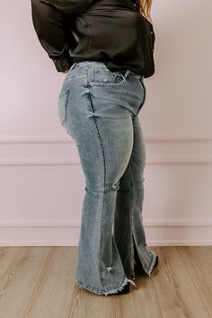 - You are sure to be a showstopper in these trendy flares! - Featuring stretchy denim material with accent fading - A high waistline with belt loops, a hidden zip fly, and button closure - A flattering silhouette that ends in unfinished flared hemlines with frayed detail Measurements 1XL : Front Rise 14.5", Hip 38", Inseam 32.5", Length 45", Waist 32". 2XL : Front Rise 15", Hip 42", Inseam 33", Length 46", Waist 36". 3XL : Front Rise 15.5", Hip 44", Inseam 33", Length 46", Waist 38". Light Wash Distressed Flare Bottoms, Denim Material, High Waist, High Waisted