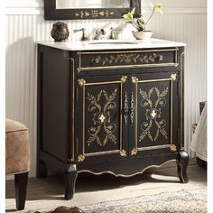 a bathroom vanity with a mirror above it and a rug on the floor next to it