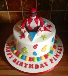 a birthday cake with a figure on top