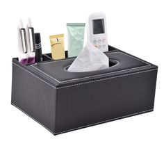 a tissue dispenser with several items in it