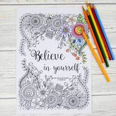 an adult coloring book with the words believe in yourself on it next to colored pencils