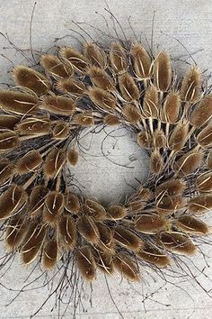 a dried wreath is sitting on the ground