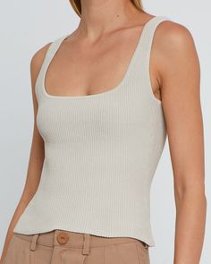 Product Details Perfect for layering, this easy tank is done with a classic scoop neck silhouette. Made from our new stretchy and sculpting ribbed knit material.- Stretchy- Thick- Ribbed knit- Content: 99% Nylon, 1% Spandex Style# C22KTP70107 Fit Notes - Recommend to size down for a more snatched fit - Model wearing a size XS- Shoulder seam to hem measures approx 18.5'' in length - Model measurements: 5'10.5'' Height / 32'' Bust / 25.5'' Waist / 34.5'' Hips Size Length Bust Waist XXS 46 56 48 XS Chic Beige Ribbed Tank Top, Ribbed Fitted Square Neck Tank Top, Fitted Ribbed Square Neck Tank Top, Ribbed Fitted Scoop Neck Tank Top, Square Neck Ribbed Stretch Tops, Fitted Ribbed Tank Top With Square Neck, Ribbed Fitted Tank Top With Scoop Neck, Chic Everyday Knit Top With Scoop Neck, Chic Seamless Knit Tank Top