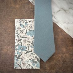 This Handcrafted Accessory Set Is Perfect For Formal Events Such As Weddings, Holiday Parties, Religious Ceremonies, Proms Or Even A Romantic Anniversary Date - An Excellent Gift For Any Gentleman That Enjoys Dressing Up Dapper For Special Occasions! Includes: (1) Solid Textured Necktie / 100% Cotton / Slim (2.5” Width) / Approx. Length 58”/ Dry Clean Only (1) Floral Print Pocket Square 100% Cotton / Approx. 12”X 12”/ Dry Clean Only Thank You! White Tie Groom, Mens Wedding Ties, Floral Pocket Square, Blue Necktie, Groom Ties, Romantic Anniversary, Mens Attire, Floral Pocket, Anniversary Dates