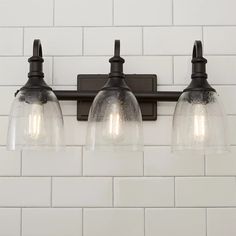 three light bathroom fixture with clear glass shades