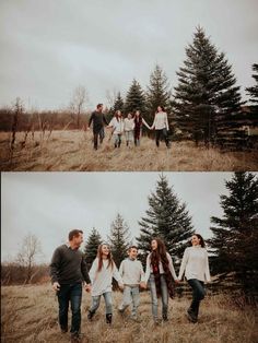 four people are holding hands and walking through the grass with trees in the back ground