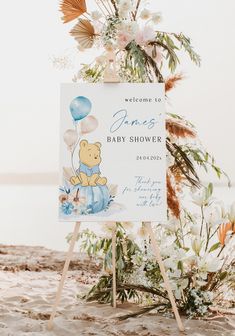 a welcome sign for a baby shower on the beach