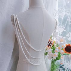 Material: glass Color: cream 3 layers of pearl back chain, the first layer of pearl chain is about 62 cm, and the last layer is about 82 cm. Pearl size:4mm,6mm Lobster clasp fastens the ends. Hello. Welcome to visit my store. Products are handmade and cannot be guaranteed to be 100% identical. Emily is responsible for one-person shop, material selection, design, production, delivery and after-sales. If you have any questions, you can contact me and I will reply as soon as possible. Most of the time is made in the workshop, so the reply to the message may not be promptly, please understand. The product does not support return or exchange, but if there is any quality problem, please feel free to contact me and I will solve the problem. Each jewelry needs 1-5 hours of production time, if you Elegant White Layered Necklace For Wedding, White Pearl Chain Layered Necklace For Wedding, White Pearl Backdrop Necklace, Pearl Backdrop, Backdrop Necklace Wedding, Backdrop Necklace, Back Chain, Backdrops Necklace, Material Selection