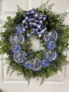 a wreath with blue and white plates on it