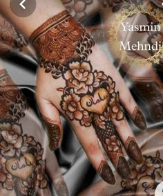 the hands are decorated with henna and flowers