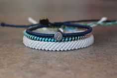 set includes 3 bracelets 1 navy blue letter bracelet 1 multicolor spiral bracelet 1 flat braided white bracelet Adjustable Spiral Bracelet, White Bracelet, Letter Bracelet, Bracelets Set, White Bracelets, Couple Bracelets, Unisex Bracelets, Matching Bracelets, Braided Bracelets