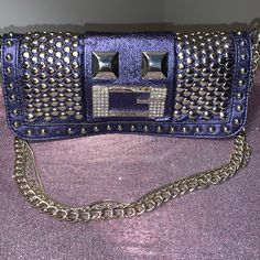 New Condition Please See Pictures Can Be Worn As A Clutch Or A Shoulder Bag. Color: Blue Pewter Leather Measurements: 9"L X 8"W X 4"H Blue Rectangular Embellished Shoulder Bag, Blue Guess Bag, Chic Blue Shoulder Bag With Silver-tone Hardware, Blue Rectangular Shoulder Bag With Silver-tone Hardware, Guess Shoulder Bag, Purple Rectangular Shoulder Bag With Gold-tone Hardware, Guess Purses, Guess Handbags, Grey Shoulder Bag