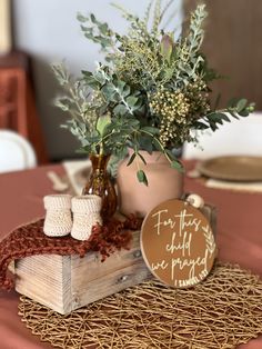 there is a potted plant on top of a wooden box with some corks