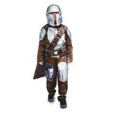 a young boy wearing a star wars boba fett costume