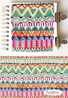 an open notebook with colorful designs on it