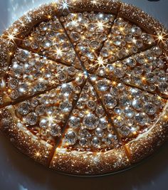 a lighted pizza sitting on top of a table