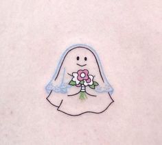 a sticker with a bride's veil and flowers on it is in the shape of a ghost