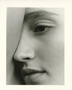 a black and white photo of a woman's face