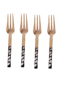 four forks with black and white designs on them