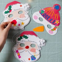 someone is making masks for christmas on the table