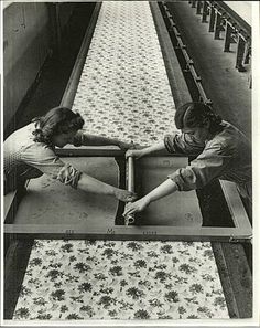 two women are working on an assembly line