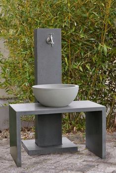 an outdoor sink with a bowl on it