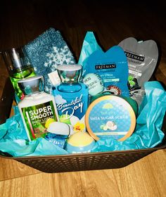 a basket filled with personal care items on top of a wooden table