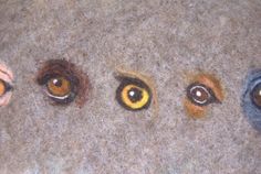 four different colored eyes are shown in the same pattern as they appear to be made out of felt