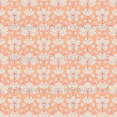 an orange and white flower pattern with swirls in the center, on a beige background