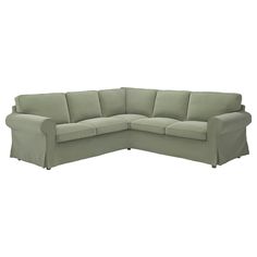 a large sectional couch with two pillows on the back and one arm folded over it