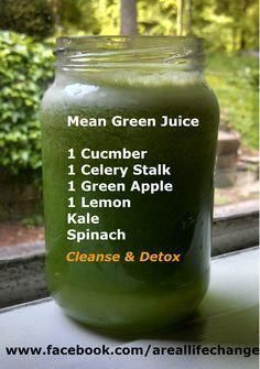 a jar filled with green juice sitting on top of a window sill