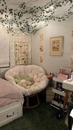 a bedroom with two beds and lots of pictures on the wall above them, along with other furniture