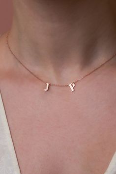 Wear your heart on your neckline with our 14k gold dainty monogram necklace. Thoughtfully designed to capture memories and moments, each initial pendant represents a story close to your heart. Whether a gift for a loved one or a treat for yourself, this necklace is a symbol of timeless connection. #TwoLetterNecklace Minimalist Anniversary Name Necklace With Initials, Minimalist Initial Necklace With Name For Anniversary, Minimalist Initial Necklace For Birthday, Minimalist Initial Name Necklace For Anniversary, Minimalist Initials Charm Necklace For Birthday, Minimalist Personalized Initial Necklace For Birthday, Minimalist Initial Necklace For Birthday And Mother's Day, Dainty Personalized Initial Necklace For Birthday, Minimalist Initial Pendant Name Necklace For Birthday