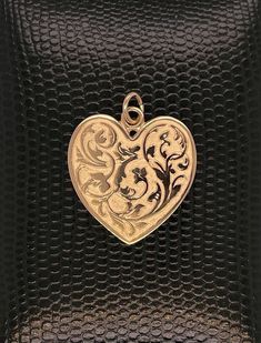 14kt solid gold heart is exceptionally detailed, made from a hand engraved model. Measuring 29mm by 24mm ( without ring). A future heirloom. 6.7g. Money back guarantee within 14days. Buyer pays return shipping and must be returned in original condition with box and no alterations. Collectible 14k Gold Heart-shaped Jewelry, 14k Gold Engraved Double Heart Jewelry, Engraved 14k Gold Double Heart Jewelry, Antique Heart-shaped Yellow Gold Jewelry, Elegant Etched Heart Pendant Jewelry, Engraved Jewelry Collectible For Valentine's Day, Heart-shaped Yellow Gold Jewelry With Intricate Design, Heart Shaped Yellow Gold Jewelry With Intricate Design, Valentine's Day Yellow Gold Jewelry With Intricate Design