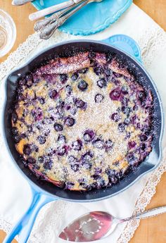 a blueberry cobbler in a cast iron skillet