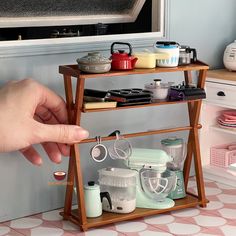 a person is reaching for some items on a shelf