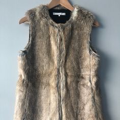 Zara Trafaluc Outerwear Faux Fur Vest. Size S. Lined, Hook Closure (3 Hooks) And Pockets. Super Comfortable, Warm And Stylish! Zara Beige Outerwear With Faux Fur Lining, Zara Faux Fur Outerwear With Fur Trim, Brown Fur Coat With Faux Fur Lining For Spring, Zara Faux Fur Outerwear, Spring Brown Fur Coat With Faux Fur Lining, Brown Faux Fur Lined Coat For Spring, Faux Fur Vest, Faux Fur Vests, Zara Jackets