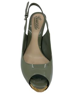 This is an pair of current Gucci Patent Leather Sofia Straw Heel Slingback Sandals Size 6 | 36 crafted from glossy olive green patent leather uppers with well-rounded peep toe. Featuring a woven straw stiletto heel, a hidden platform and an adjustable leather slingback strap with a mini horsebit buckle accent. Condition: Excellent. No visible wear on the patent leather uppers but creasing has developed on the sides. Bottom soles have some scuffing. Olive green patent leather Straw heel, 5'' Hidd Ysl Shoes, Jimmy Choo Sunglasses, Chanel Sunglasses, Slingback Sandals, Dior Shoes, Louis Vuitton Shoes, Prada Shoes, Slingback Sandal, Stiletto Heel