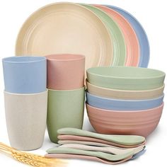 there are many different colored dishes and cups