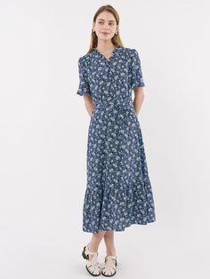 Editor's NoteThis is a long dress with a gentle flower print that gives a feminine feel. A slim fit and flared skirt creates a feminine silhouette.- Ruffles on the neck and sleeves- Can be opened and closed with a zipper on the back- There is a string to tie a ribbon on the side of the waist- Available in 2 colors: Blue, RedMeasurements (in.)55 / 66- Length: 46.85 in. / 47.64 in.- Shoulder: 14.17 in. / 14.57 in.- Bust: 38.98 in. / 40.94 in.- Waist circumference: 28.35 in. / 30.31 in.- Sleeve: 10.63 in. / 10.63 in.Composition & Care- 100% Polyester- Please check the care labelDesigner- by OLIVE DES OLIVE Fitted Floral Maxi Dress With Ruffle Hem, Modest Fitted Floral Dress For Spring, Modest Short Sleeve Floral Dress With Ditsy Print, Short Sleeve Midi Dress With Ditsy Floral Print, Modest Fitted Floral Maxi Dress, Fitted Floral Midi Dress With Ruffle Hem, Modest Short Sleeve Floral Dress, Floral Print Fit And Flare Maxi Dress, Modest Ditsy Floral Midi Dress For Garden Party