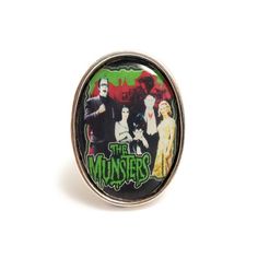 The Munsters, America's First Family of Fright!!"The Munsters is an American television sitcom depicting the home life of a family of benign monsters. It stars Fred Gwynne as Herman Munster and Yvonne De Carlo as his wife, Lily Munster. The series was a satire of both traditional monster movies and the wholesome family fare of the era. It ran concurrently with the similarly themed The Addams Family from 1964 to 1966." - Wikipedia This quirky ring features the whole family from "The Munsters" inc Fred Gwynne, Horror Werewolf, Munsters Tv Show, Vampire Horror, Quirky Ring, Herman Munster, Monster Movies, Lily Munster, Steampunk Rings