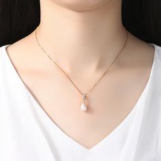 This 18K gold plated .925 sterling silver natural pearl pendant necklace is a statement of minimal elegance. Accented with lab create diamonds, it has just a touch of sparkle. 18" long box chain + 2" extender 3 cubic zirconia lab created diamonds on the bail 8mm natural freshwater pearl pendant pendant 20mm ( 3/4") long Necklace Metal: 18K gold plated 925 Sterling Silver Closure: Spring Ring Imported Pearl Clavicle Chain Necklace As Gift, Cubic Zirconia Pearl Necklace With Clavicle Chain For Gift, Clavicle Chain Pearl Necklace With Cubic Zirconia As Gift, Elegant Diamond White Jewelry With Box Chain, Elegant Box Chain Necklace Gift For Her, Collar Chain, Pearl Necklaces, Luxury Necklace, Necklace Brands