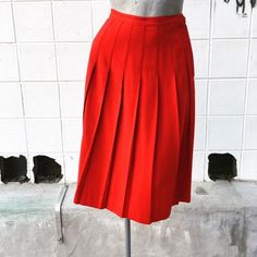 Waist 26 inchesLength 26 inchesBeautiful, bright red. Excellent condition. Unlined. Wool. Classic Red Skirt, Red Retro Pleated Skirt, Red High Waist Lined Pleated Skirt, Red High Waist Pleated Skirt With Lining, Red High Waist Pleated Skirt, High Waist Red Pleated Lined Skirt, Red Knee-length Pleated Skirt For Spring, Retro Red Pleated Bottoms, Red High-waist Pleated Skirt For Spring