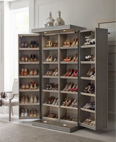 a large closet with many pairs of shoes in it